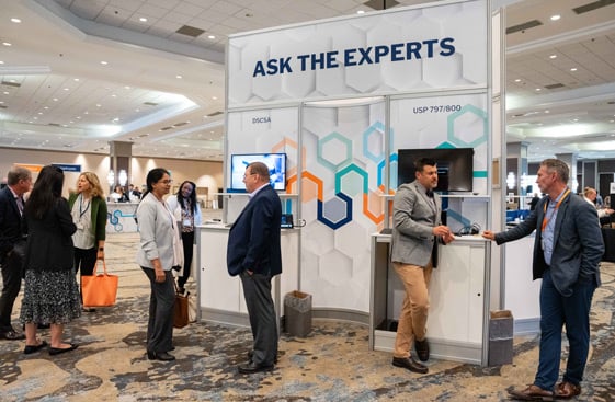 People standing around an Ask the Expert booth